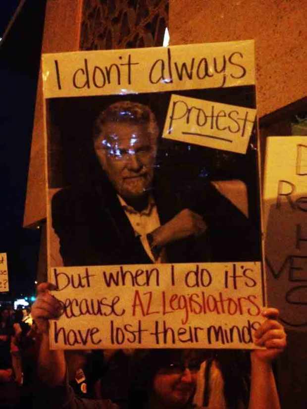 A protestor sign that says "I don't always protest but when I do it's because AZ Legislators have lost their minds."